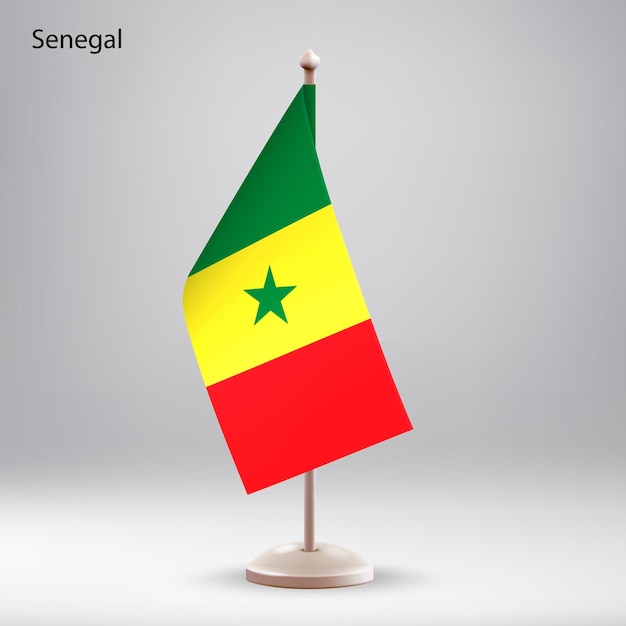 Le drapeau du Sénégal suspendu à un porte-drapeau