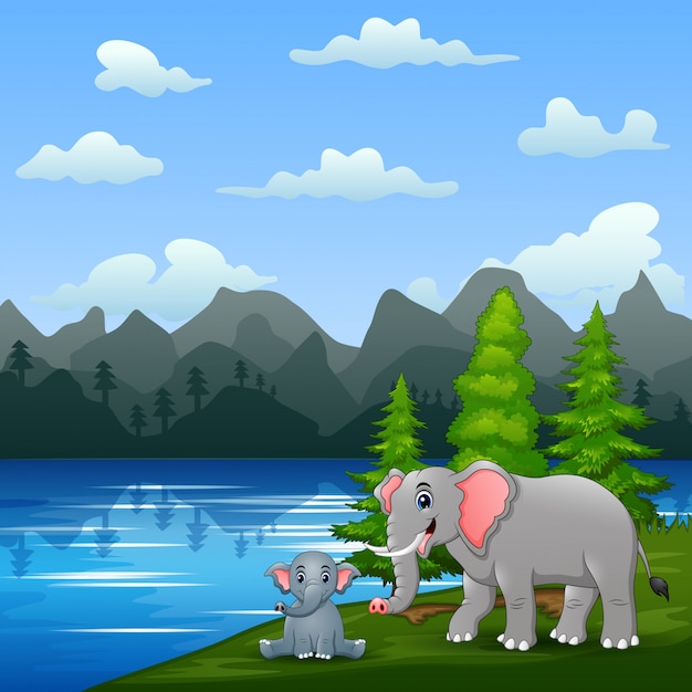 Un éléphant Avec Son Petit Jouant Au Bord De La Rivière