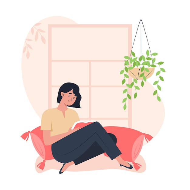 femme assise près de la fenêtre et lisant un livre