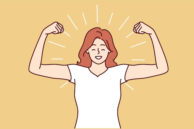 Une femme montre des biceps et des sourires debout dans une pose d'homme fort pour démontrer sa confiance en soi