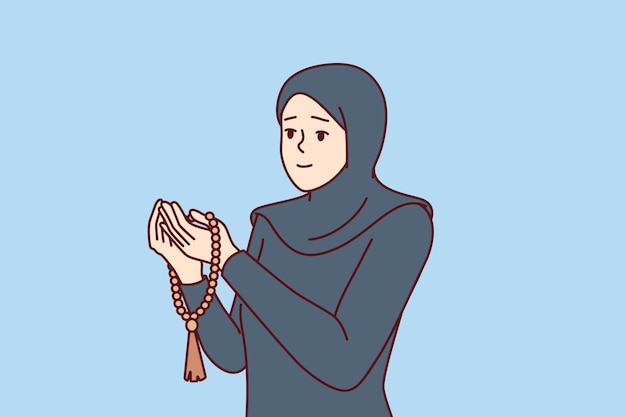 La femme musulmane en prière est vêtue de vêtements islamiques avec le hijab et lit la prière en se tournant vers allah pour obtenir de l'aide Une fille en prière croyant en l'islam croit en la religion arabe et visite la mosquée