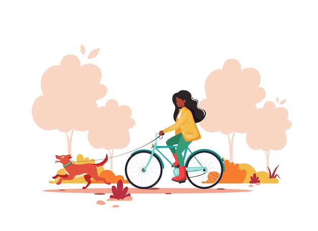 Femme Noire à Vélo Avec Chien En Automne Parc. Concept D'activité De Plein Air.