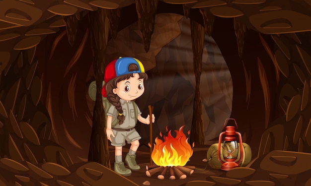 Une Fille Campant Dans La Grotte Sombre