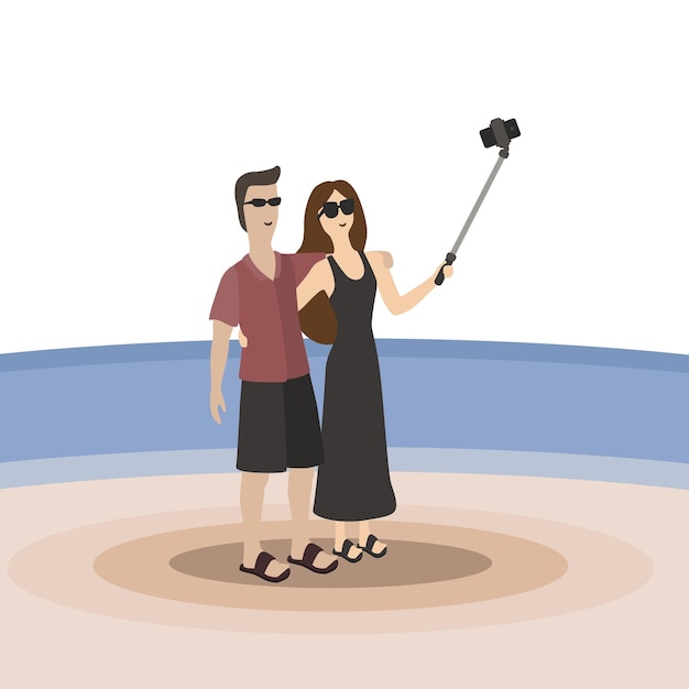Une fille et un homme en lunettes de soleil sur la plage sur le fond de la mer ou du lac sont photographiés avec un bâton selfie