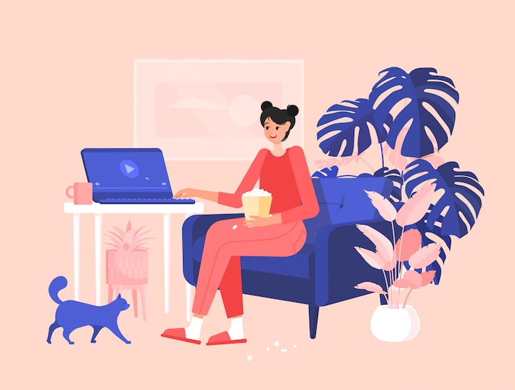 Vecteur fille en pyjama est assise à un bureau