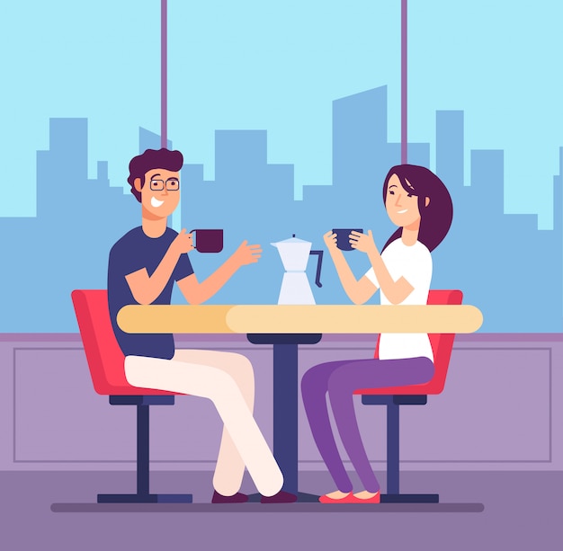Flirter femme et homme à table avec des tasses à café au café.