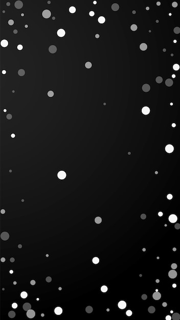 Fond de Noël à pois blancs. Flocons de neige volants subtils et étoiles sur fond noir. Modèle de superposition de flocon de neige argenté d'hiver réel. Illustration verticale fraîche.