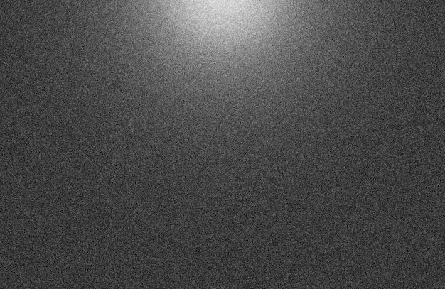 un fond noir avec une lumière dessus