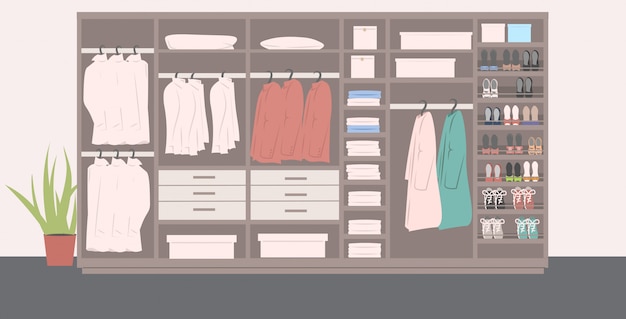 grande armoire avec différentes chaussures et vêtements élégants à l'intérieur du dressing moderne intérieur horizontal