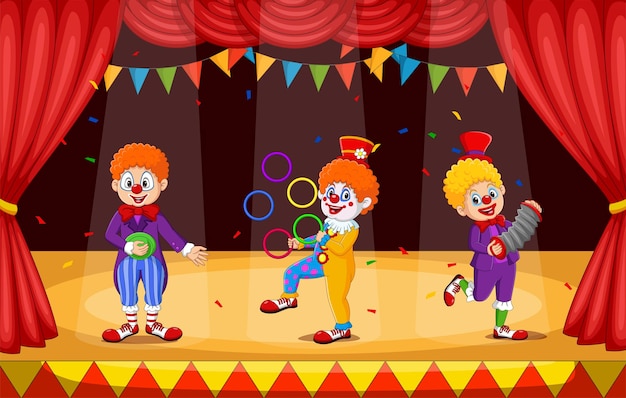 Vecteur groupe de dessin animé de clowns sur scène