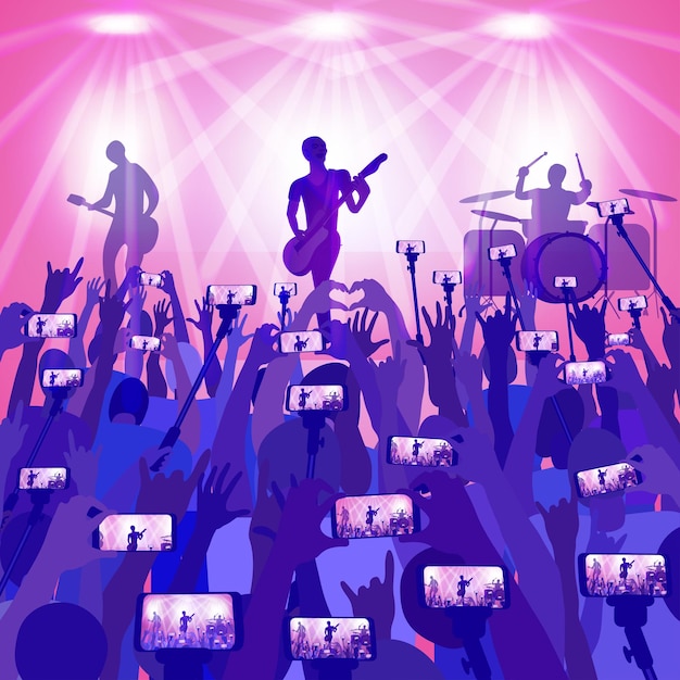 Groupe de musique. Concert de rock. Une foule de personnes lors d'un concert filme une vidéo sur leur téléphone.