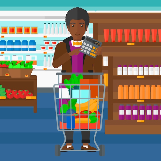 Homme comptant sur une calculatrice dans un supermarché
