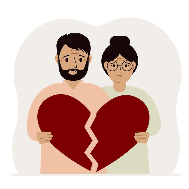 Un homme et une femme tristes tiennent dans leurs mains des morceaux d'un coeur rouge brisé