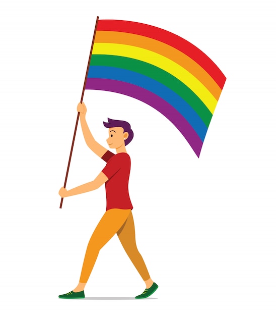 L'homme tient le drapeau arc-en-ciel pour le mouvement LGBT.