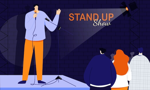 Un jeune comédien debout accueille son public au début de l'émission s'adressant directement aux gens via un microphone Monologuer des histoires humoristiques, des blagues et des oneliners