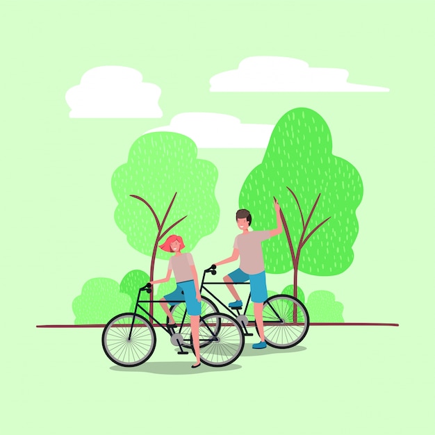 jeune couple à vélo dans le parc