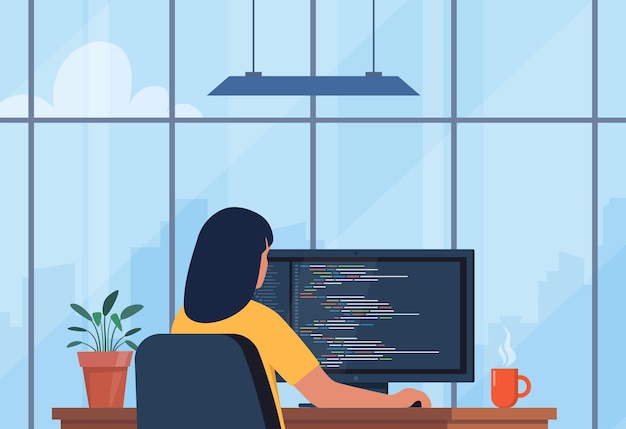 Jeune femme écrivant du code sur un ordinateur de bureau Développeur de logiciels au travail