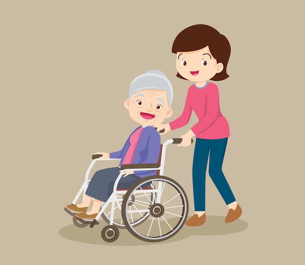 Jeune femme se promenant avec une femme âgée en fauteuil roulant