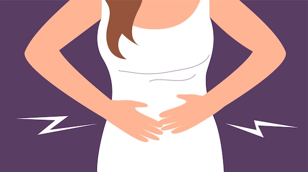 Une jeune femme souffre de douleurs abdominales