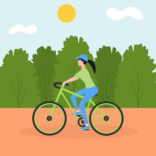 Une jeune fille sportive fait du vélo dans le parc de la ville Le concept d'activités de plein air dans la ville