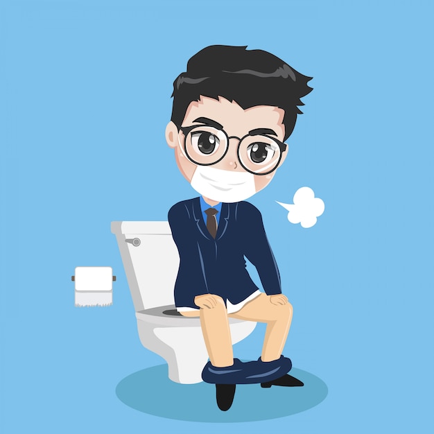 Jeune Homme D'affaires Est Assis Dans Les Toilettes.