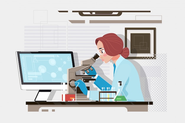 Jeune scientifique regardant au microscope dans un laboratoire