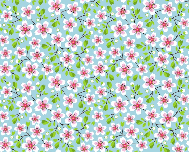 Joli motif en petite fleur. Fleurs de Sakura rose, cerisier japonais en fleurs. Symbole du printemps. Petites fleurs colorées. Fond bleu. Motif floral sans soudure. Petites fleurs printanières simples et mignonnes.