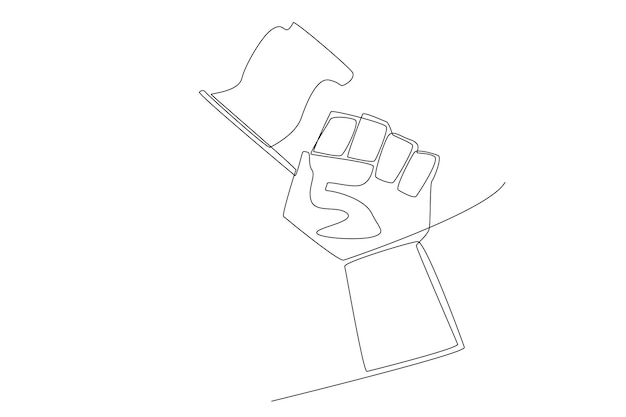 Une main tient un drapeau le jour du héros national