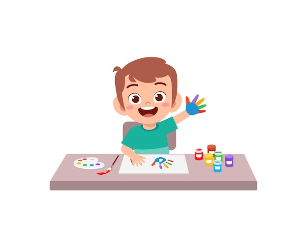 Mignon petit garçon utilisant de la peinture à la main pour l'art