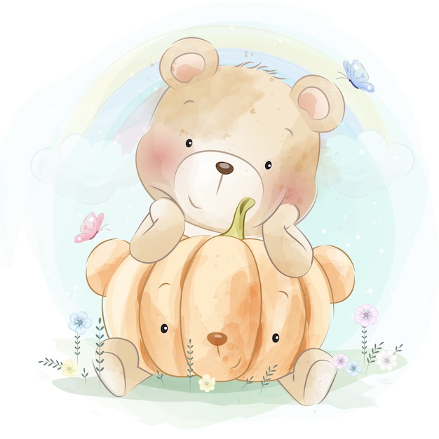 Mignon petit ours étreignant citrouille