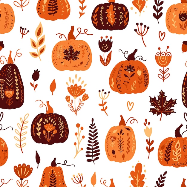 Modèle sans couture d'automne avec des citrouilles et des éléments floraux.