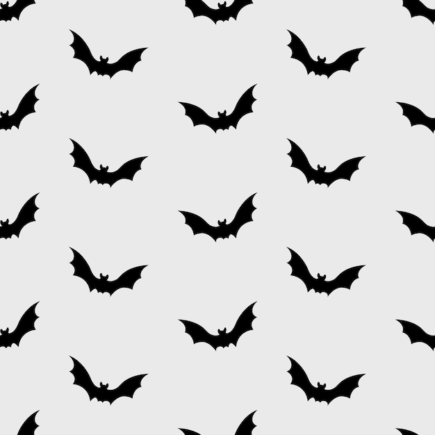 Le motif harmonieux d'Halloween gothique était composé de nombreuses chauves-souris noires volantes. Conception de papier ornemental.