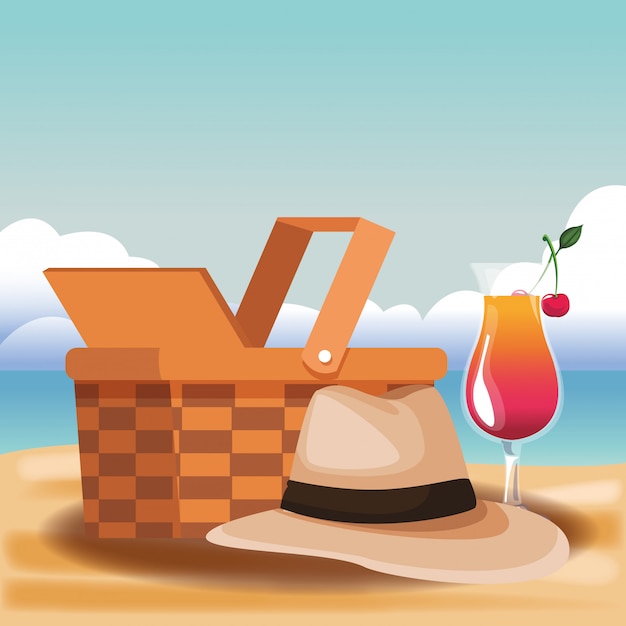 Panier pique-nique et chapeau de soleil avec cocktail