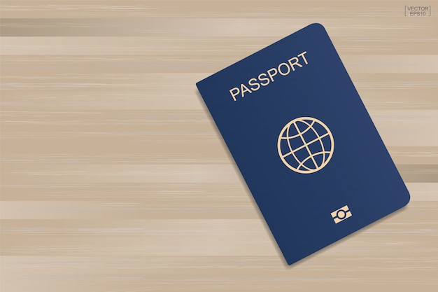 Vecteur passeport bleu sur fond de bois.