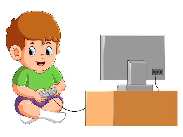 Le Petit Garçon Est Assis Et Joue Au Jeu Avec Le Joystick