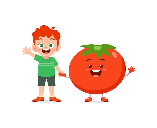 Le Petit Garçon Mignon Se Tient Avec Le Caractère De Tomate