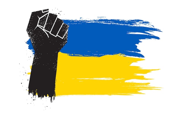 Le poing se lève avec un pinceau du drapeau de l'Ukraine