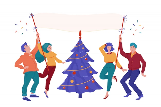 Quatre personnes heureuses, souriantes, hommes et femmes, tenant une pancarte vierge, dansant près de l'arbre de Noël