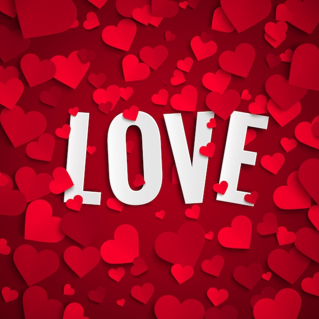 Saint Valentin, texte d'amour sur fond avec des coeurs de papier rouge