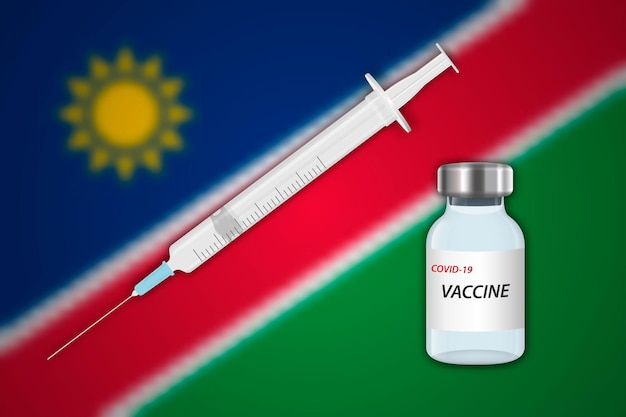 Vecteur seringue et flacon de vaccin sur fond flou avec le drapeau de la namibie