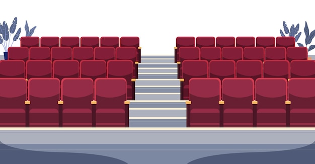 Des sièges au cinéma, un auditorium vide, des chaises rouges, des plantes, des escaliers.