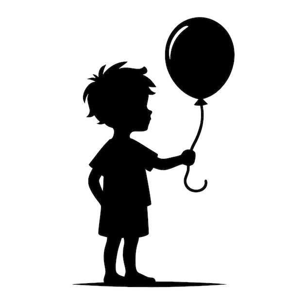Silhouette d'un garçon tenant un ballon
