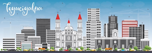 Skyline de Tegucigalpa avec bâtiments gris et ciel bleu.