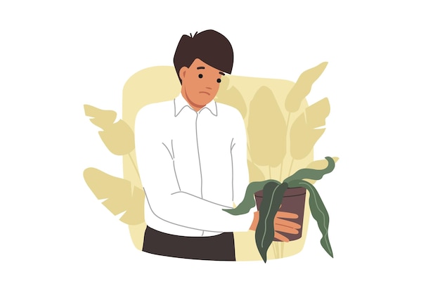 Le stress est ressenti par un homme d'affaires tenant une plante d'intérieur flétrie symbolisant le déclin de sa carrière.