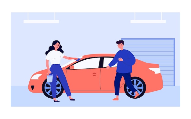 Véhicule de frottement de femme avec un chiffon dans le garage