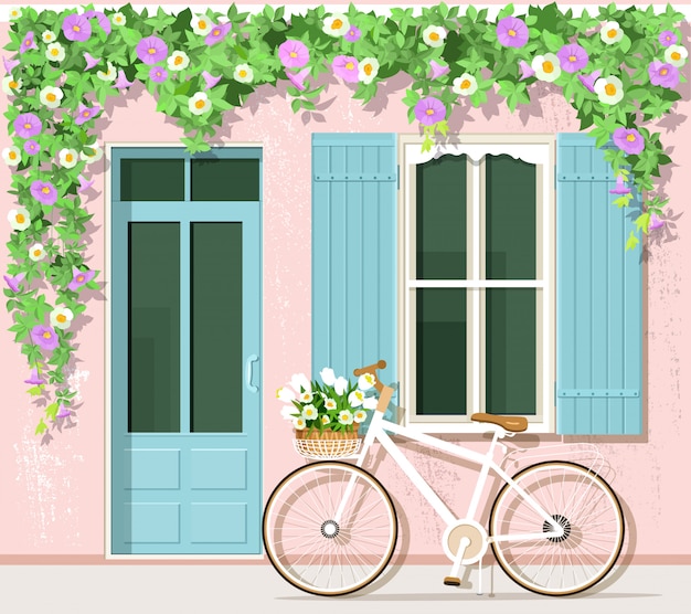 Vecteur vélo avec des fleurs près de la maison de style provençal