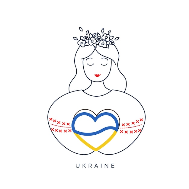 Le visage d'une jeune femme ukrainienne tenant un cœur aux couleurs du drapeau ukrainien