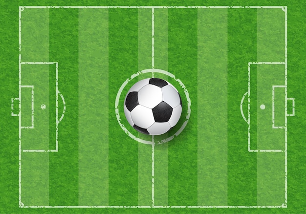 Vecteur vue de dessus ballon de football réaliste sur le terrain de football avec texture d'herbe