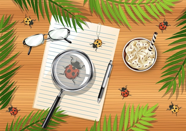 Vue de dessus de la table en bois avec des objets de bureau et des éléments de feuilles et d'insectes