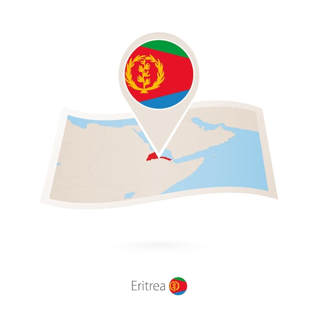 Folded paper map of Eritrea with flag pin of Eritrea
